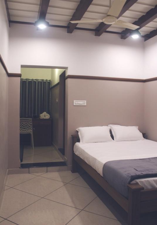 Hotel Icon Residency Kalpatta Pokoj fotografie